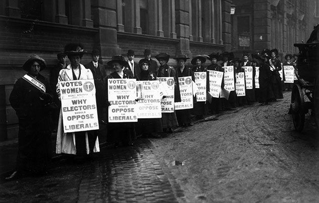 Suffragettes picketing with 'Why electors should oppose the Liberals' placards